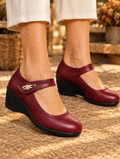 Nola leather wedge shoes in wine red worn by model