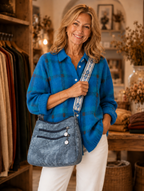 Colbie crossbody bag in blue worn by model