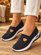 Carry orthopaedic slip-on shoes in black worn by model