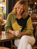 Catherine asymmetric color-block knit sweater worn while relaxing